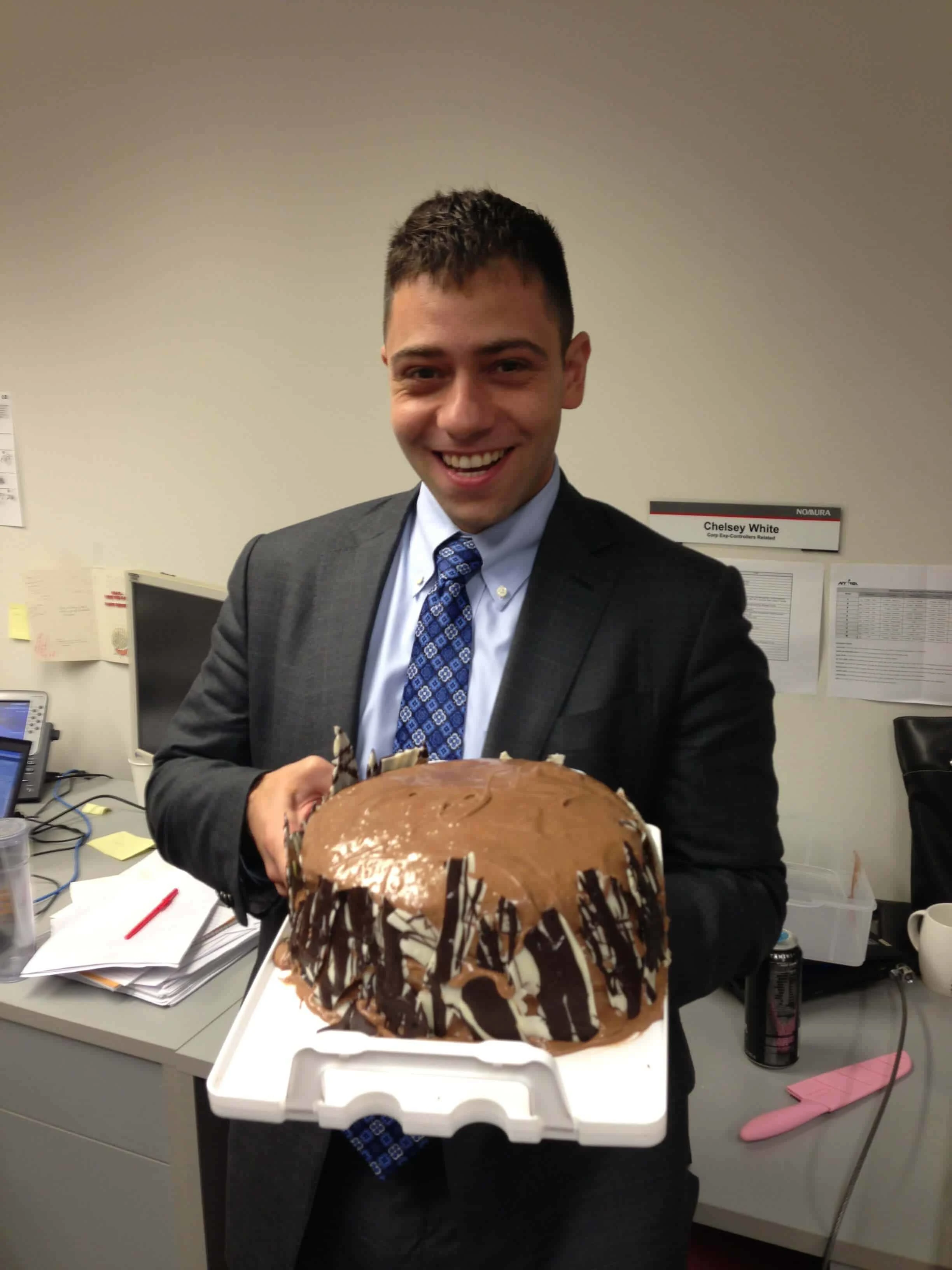 image of coworker holding up one of chelsweets first cakes