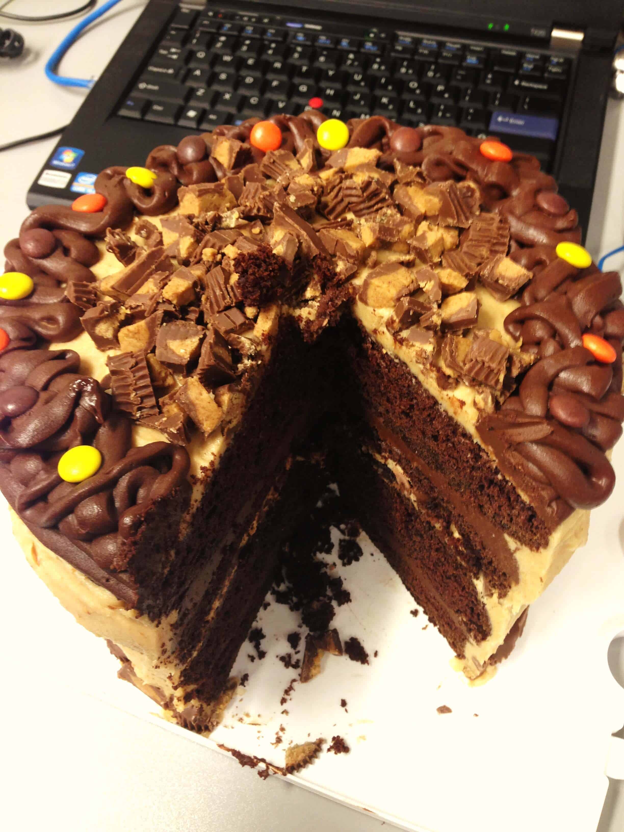 image of a reese's peanut butter cup cake that's been sliced into
