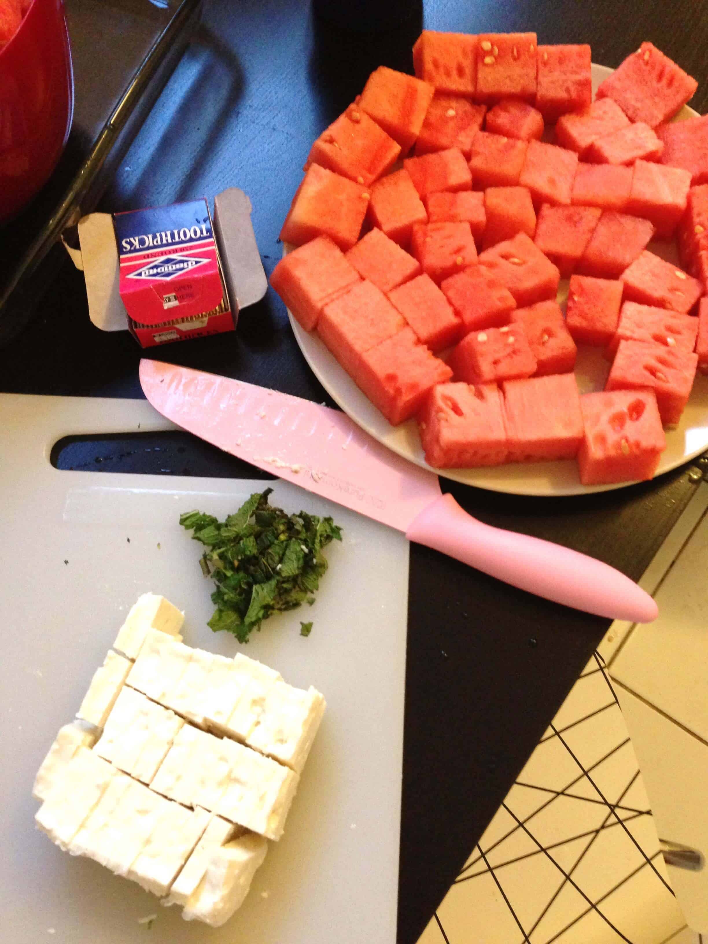 Image of watermelon and feta cut up to make a salty and sweet appetizer