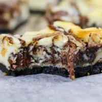 image of nutella cheesecake bars with an oreo crust