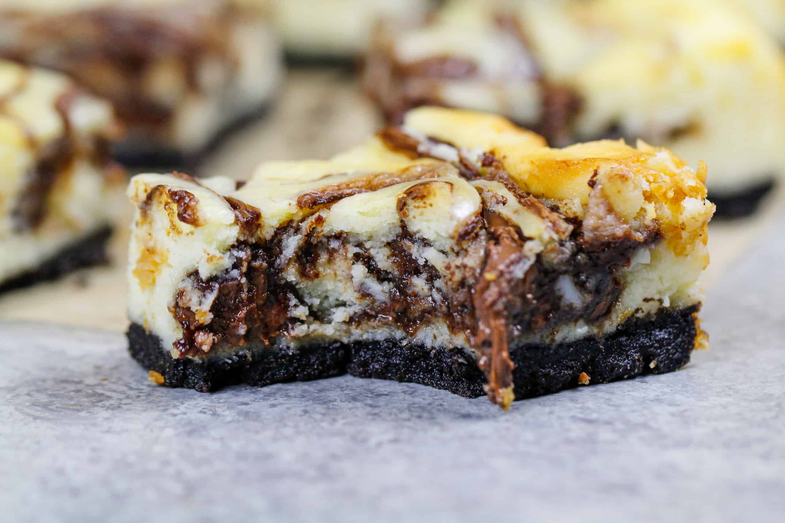 image of nutella cheesecake bars with an oreo crust