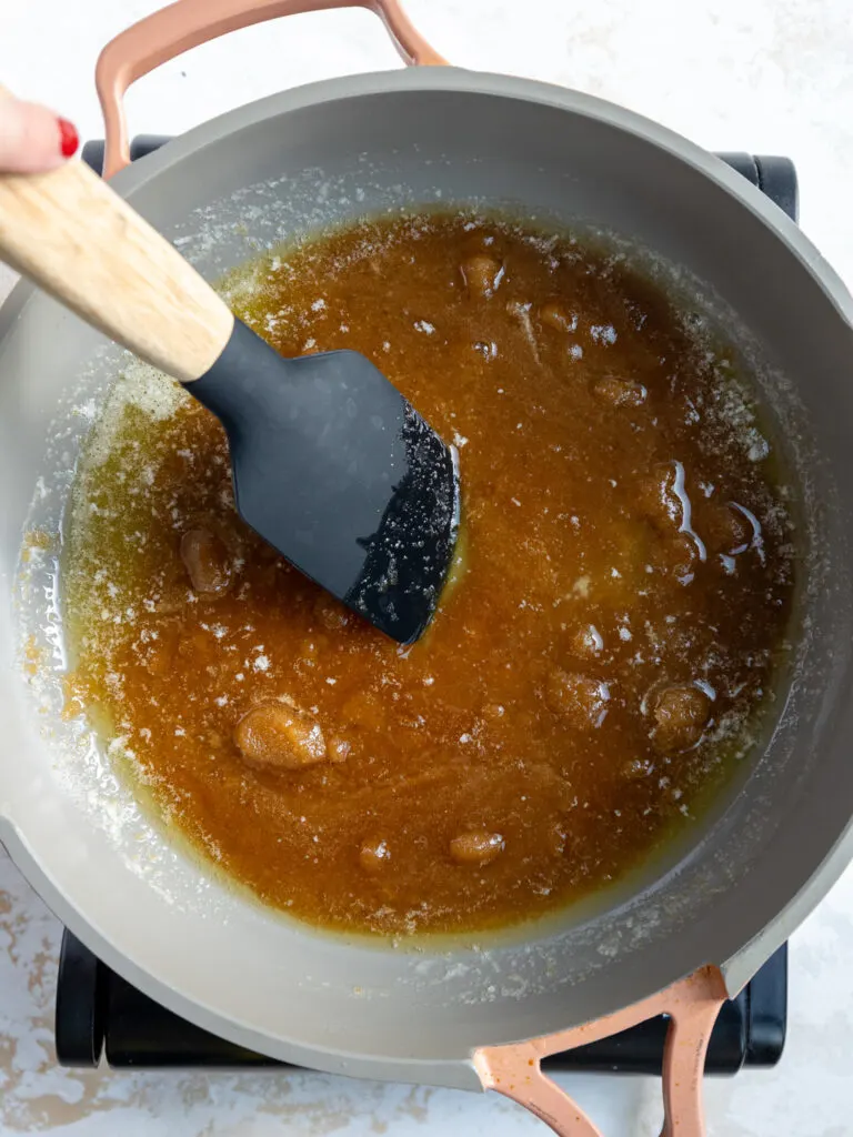 image of brown sugar and butter being melted down in a frying pan