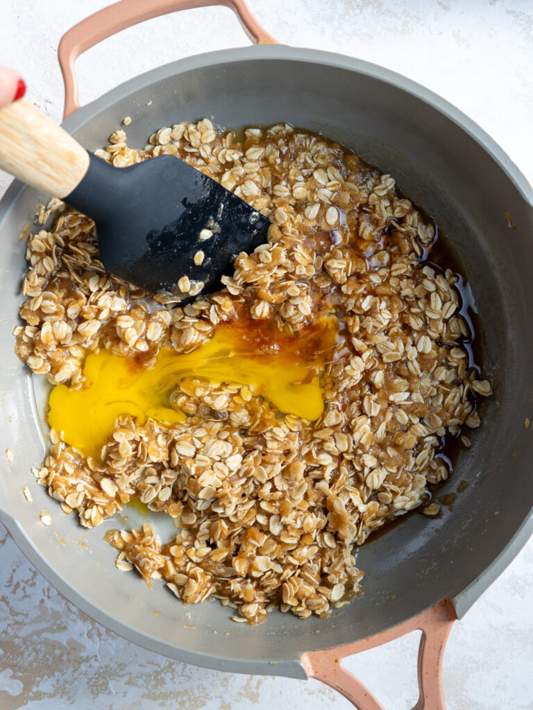 image of oatmeal lace cookie batter being mixed together in a large frying pan