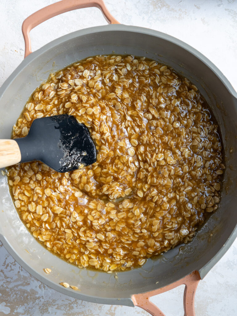 image of oatmeal lace cookie batter being mixed together in a large frying pan