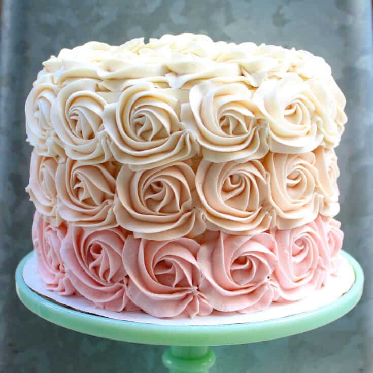 Premium Photo | Chocolate cake with roses on vintage stand. beautiful cake  with red and white rose flowers, black background