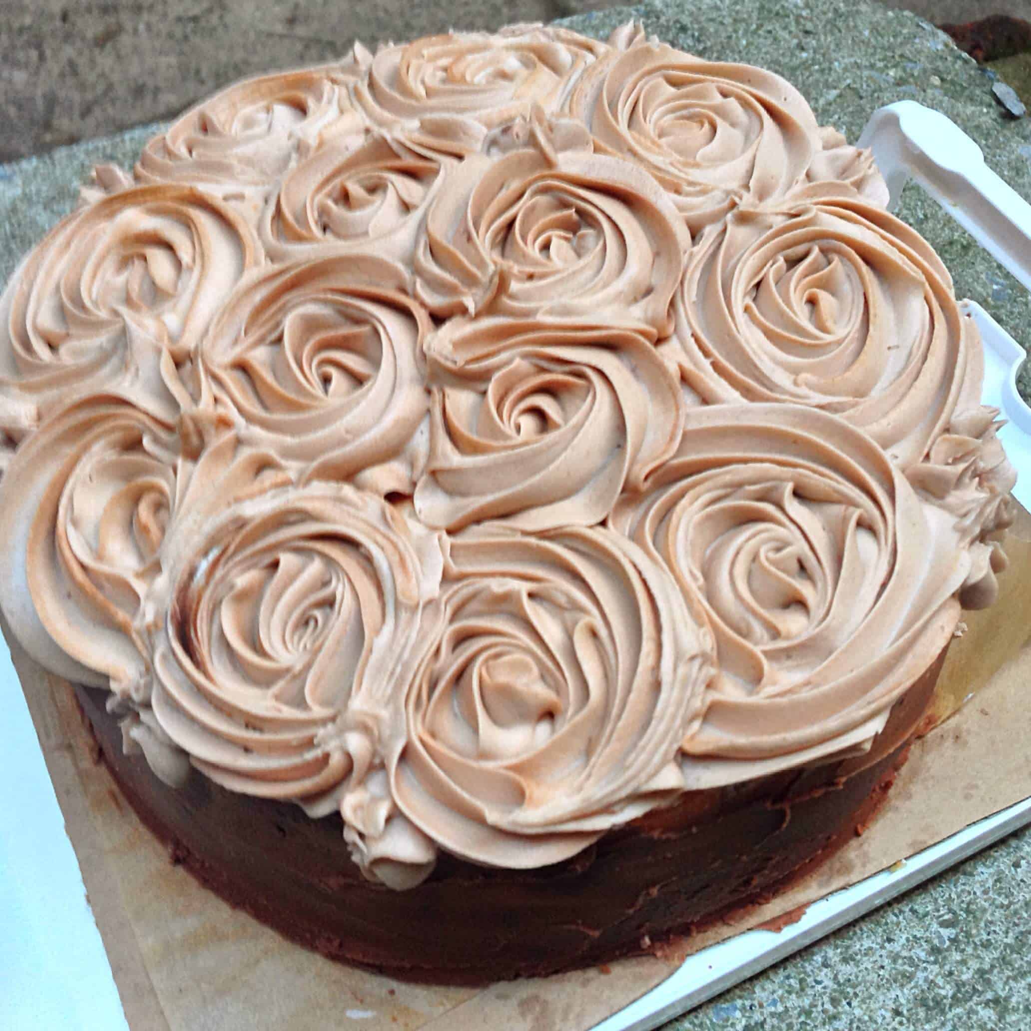 image of Nutella chocolate cake topped with buttercream roses