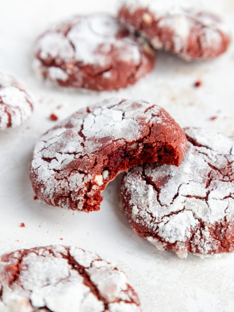 image of a red velvet crinkle cookie that's been bitten into