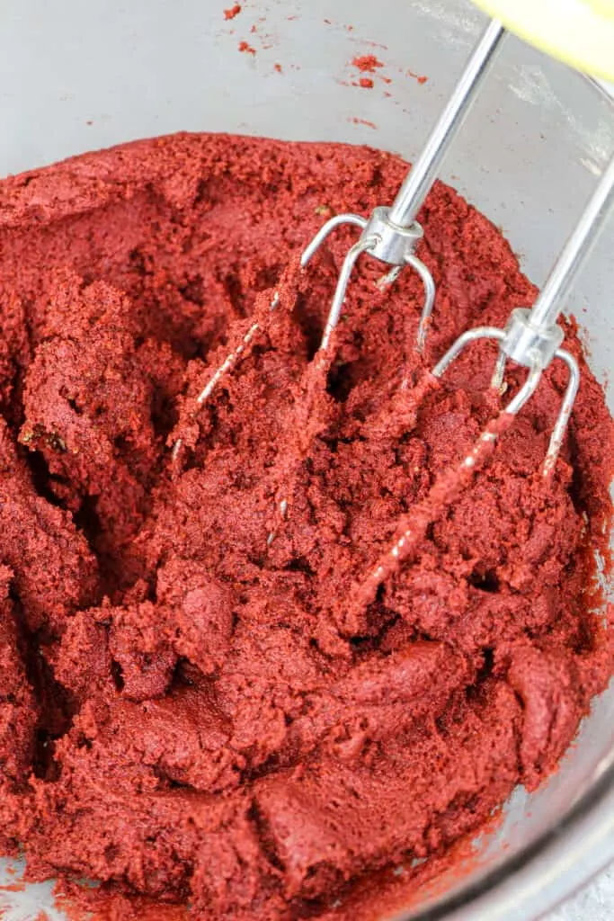 image of red velvet crinkle cookie dough that's been mixed and is ready to be scooped