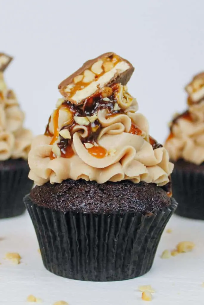 close up photo of a chocolate snickers cupcake recipe