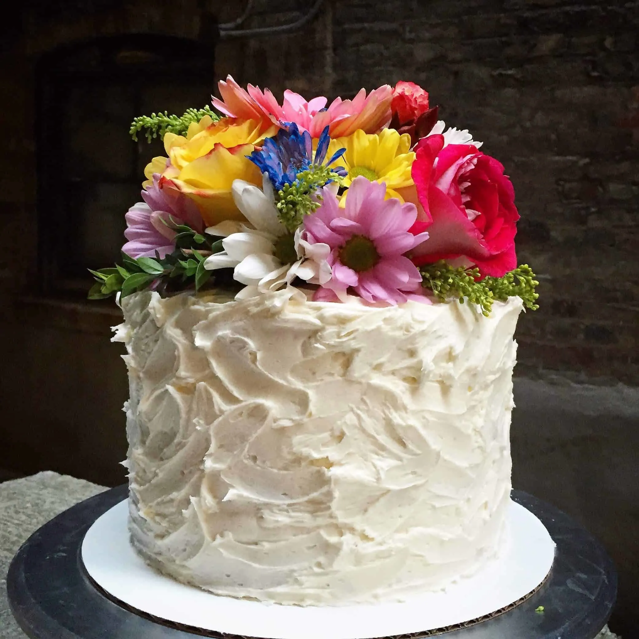 Rose water cake decorated with organic fresh flowers