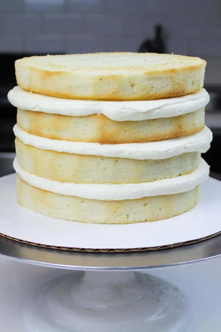Stacked vanilla cake layers - this recipe is to die for, and can be made in one bowl!!