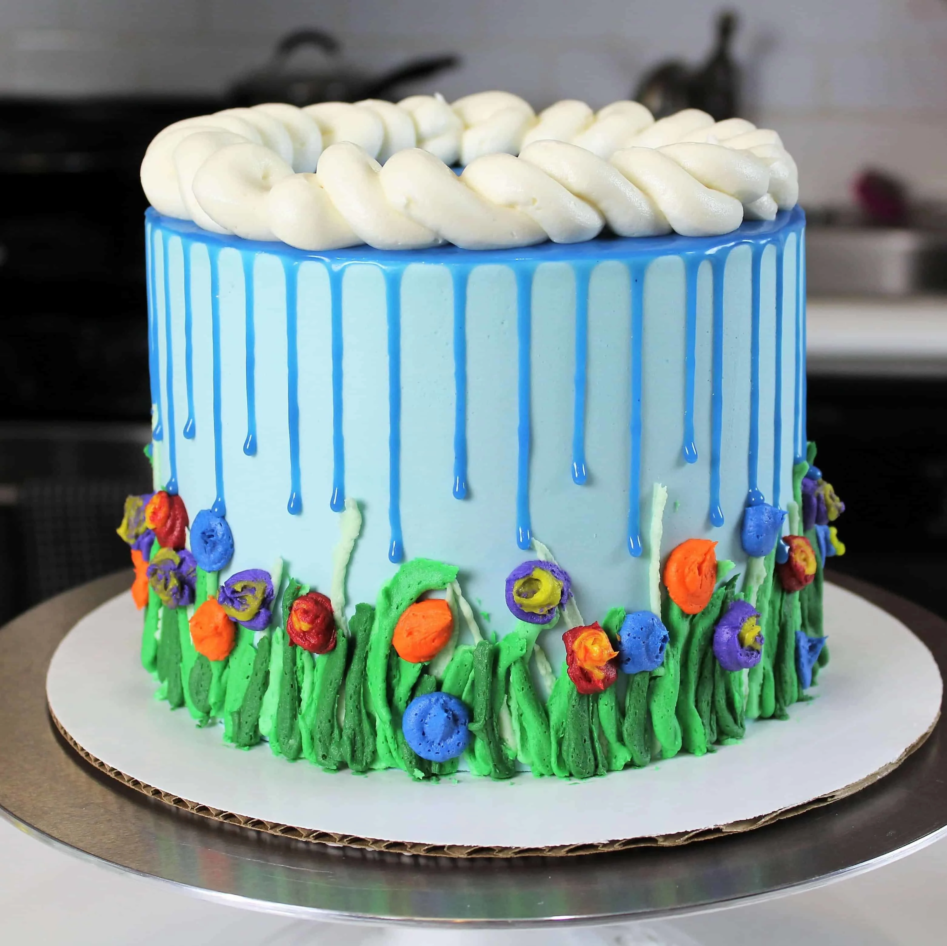 April showers cake with blue drips to look like rain
