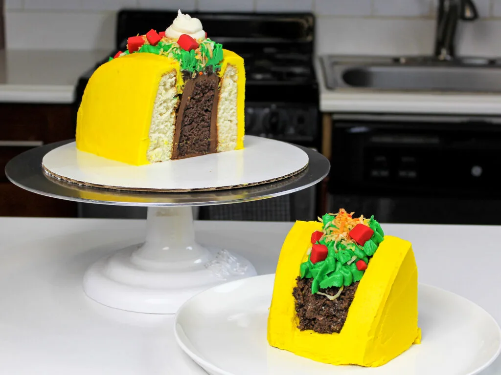 image of a taco cake that's been cut open to show it's vertical cake layers and buttercream filling