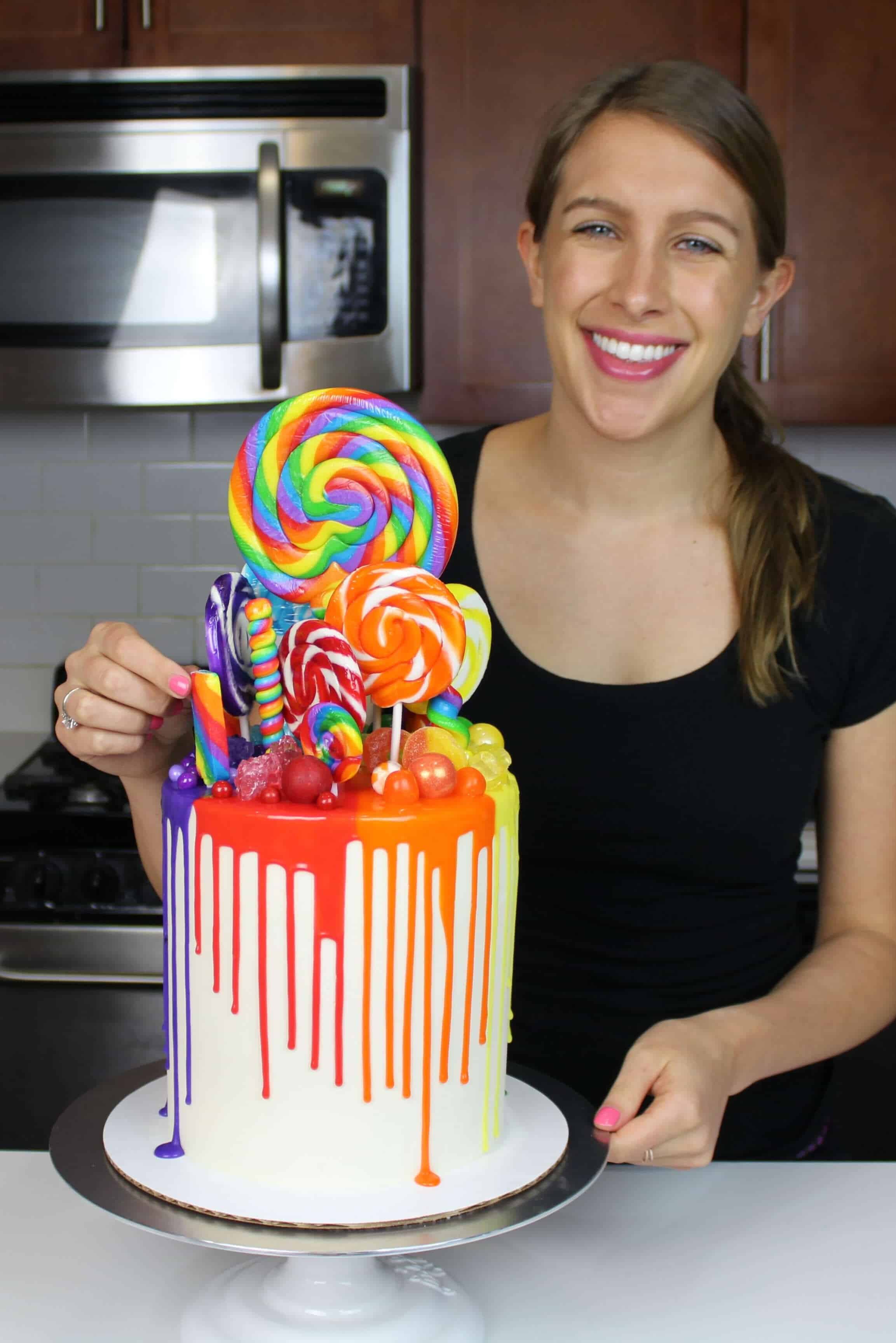 Image of Chelsey White smiling with her rainbow drip cake