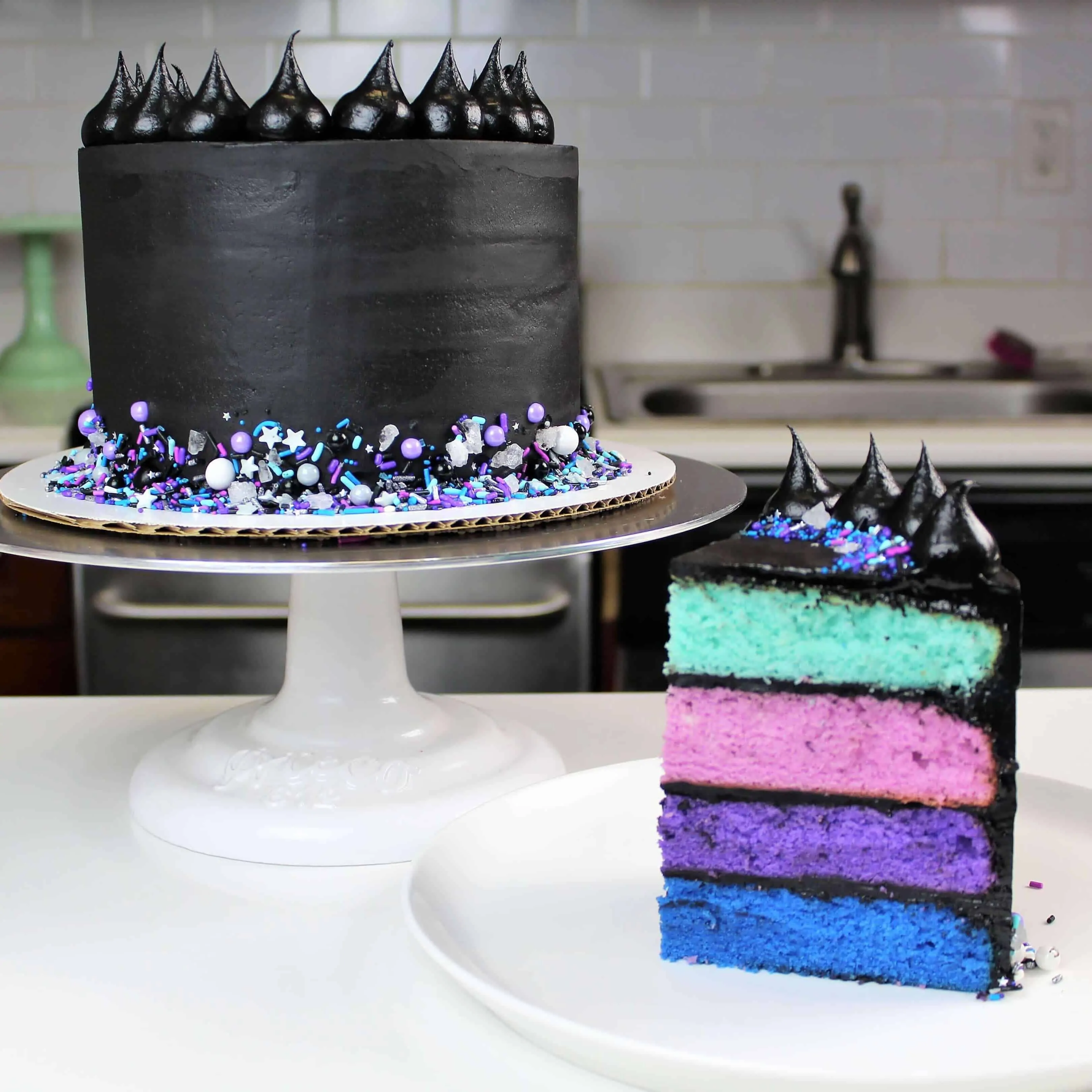 Galaxy themed cake frosted with black buttercream