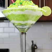 image of a boozy lime margarita trifle made in a giant cocktail glass