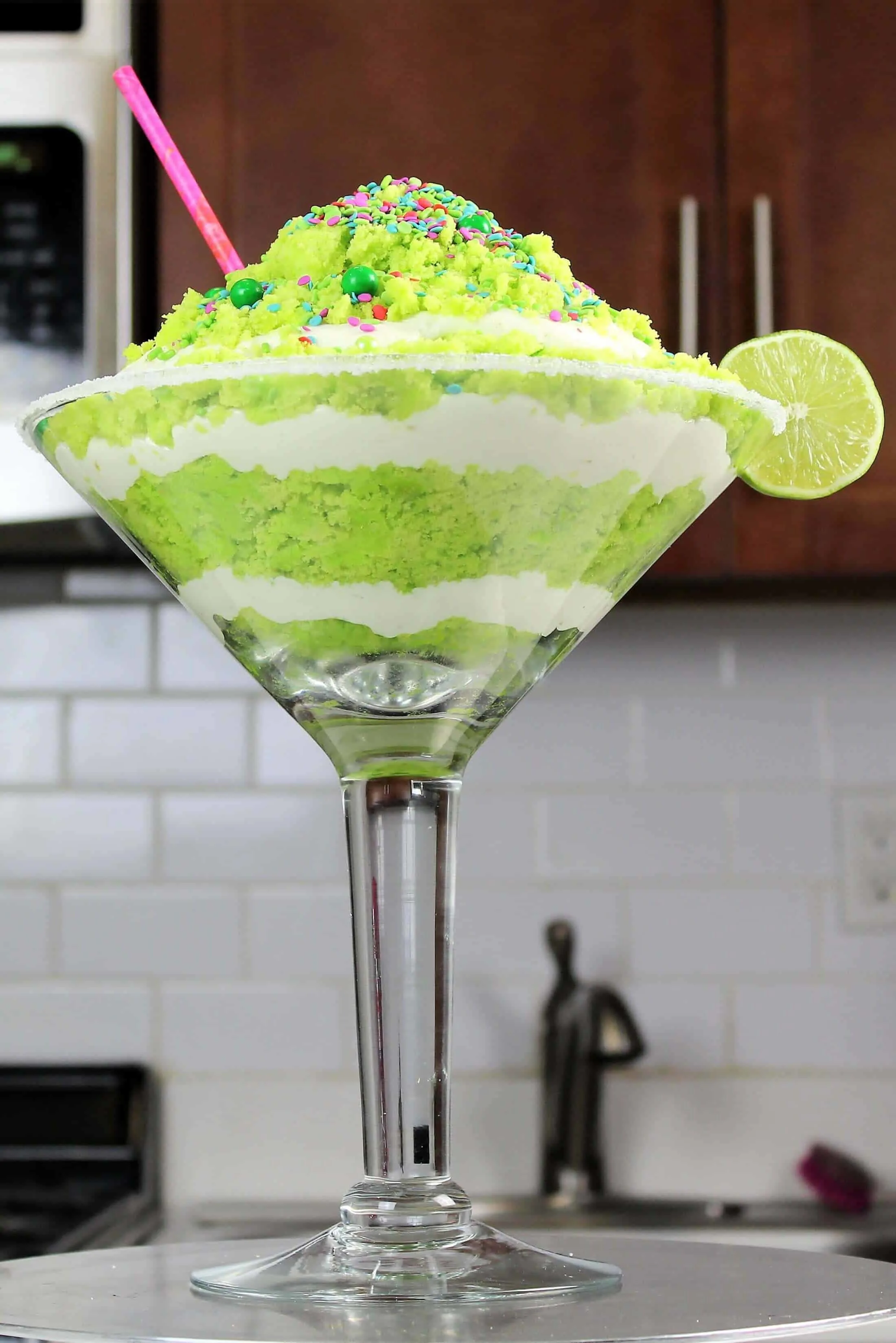 image of a boozy lime margarita trifle made in a giant cocktail glass