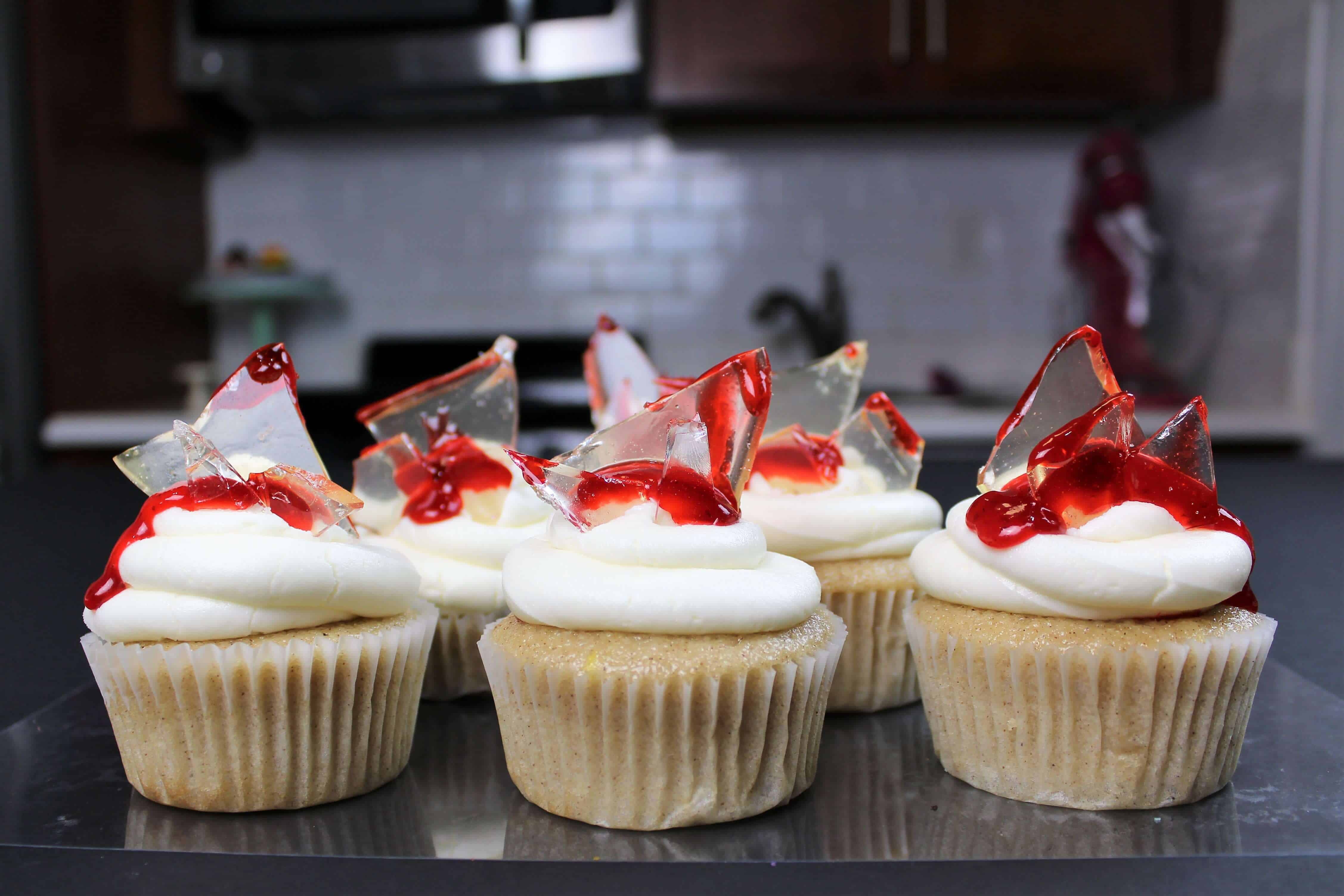 photo of shattered glass cupcakes, decorated with jam to look like blood