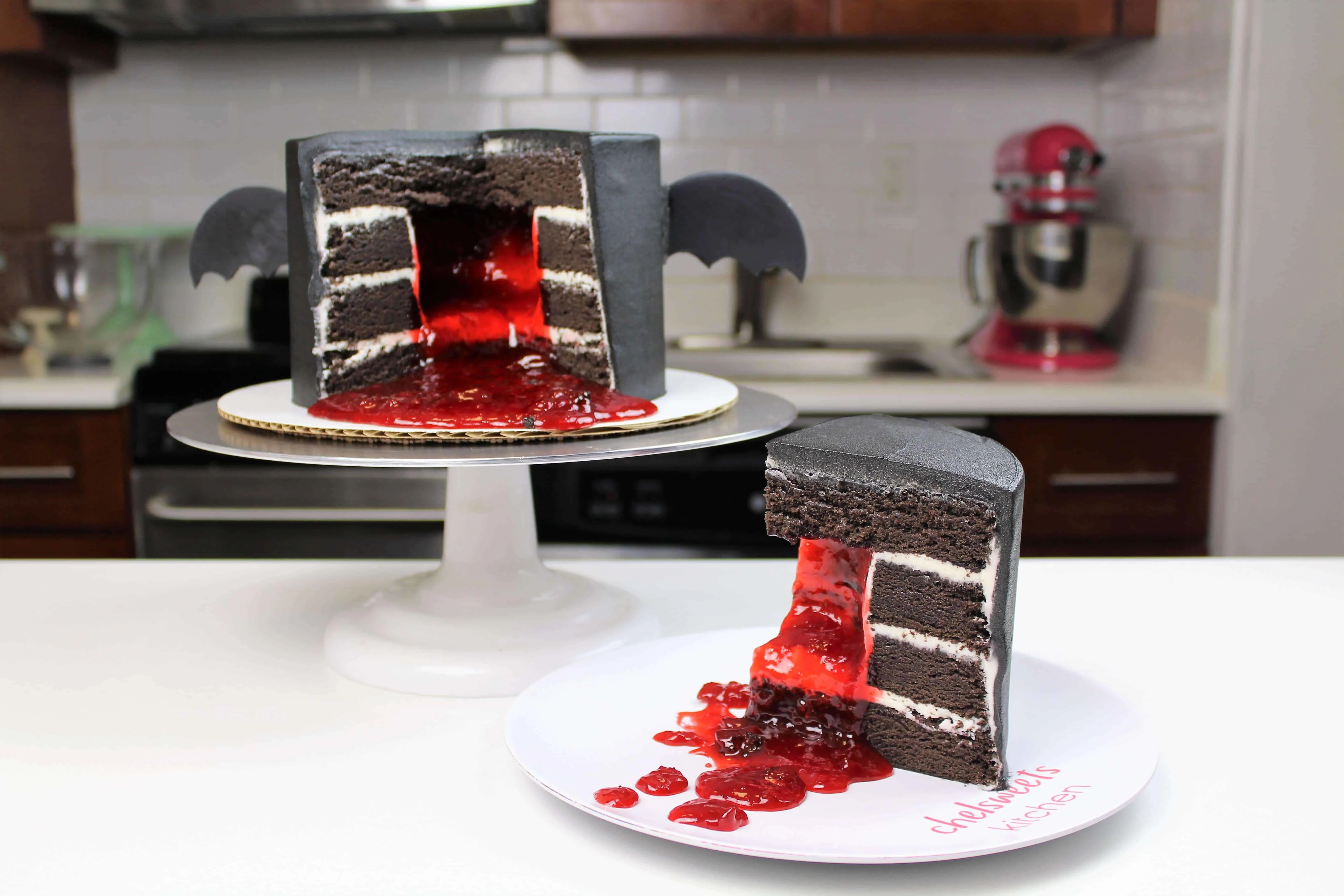 image of sliced vampire bat cake with strawberry jam filling