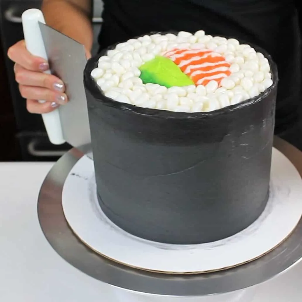 Sushi Roll cake frosted with black american buttercream