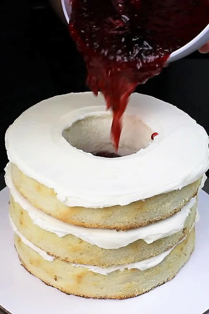 image of filling vanilla cake with strawberry jam, to look like blood