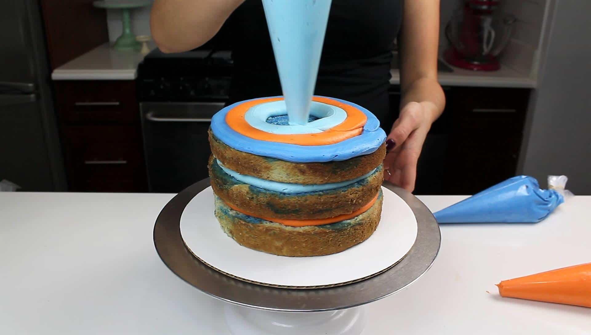 Image of stacking and frosting banana cake layers with cream cheese frosting