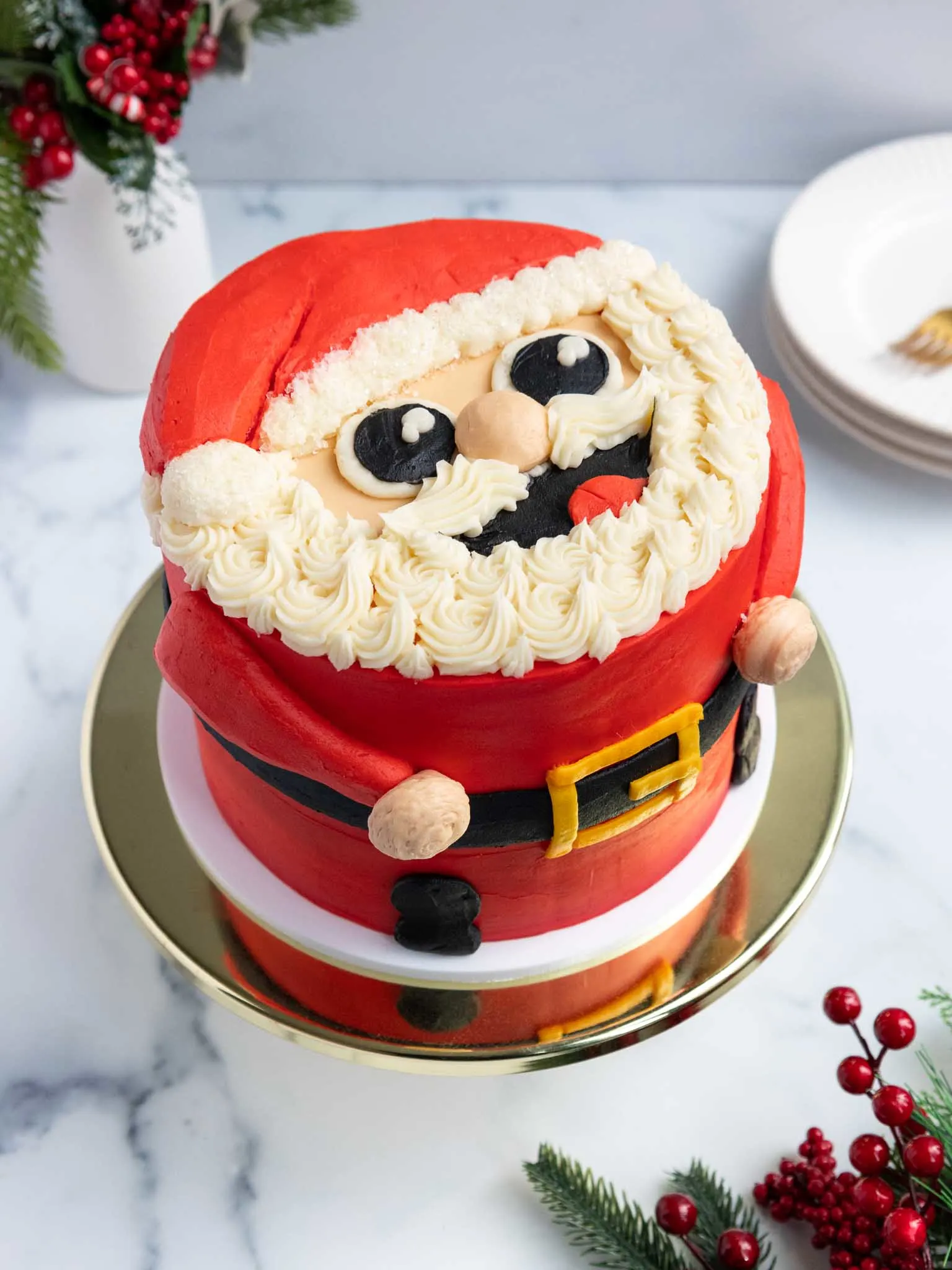 image of a cute Santa cake that's been decorated with buttercream