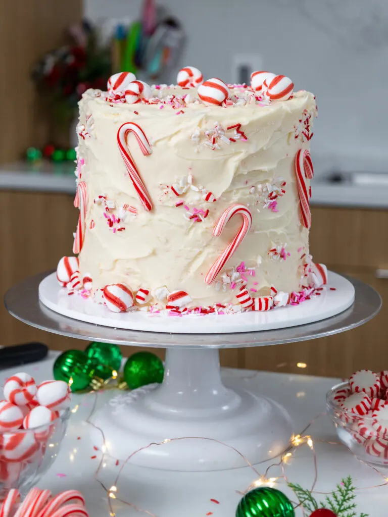 image of a cute candy cane cake decorate with mini candy canes and peppermint candies