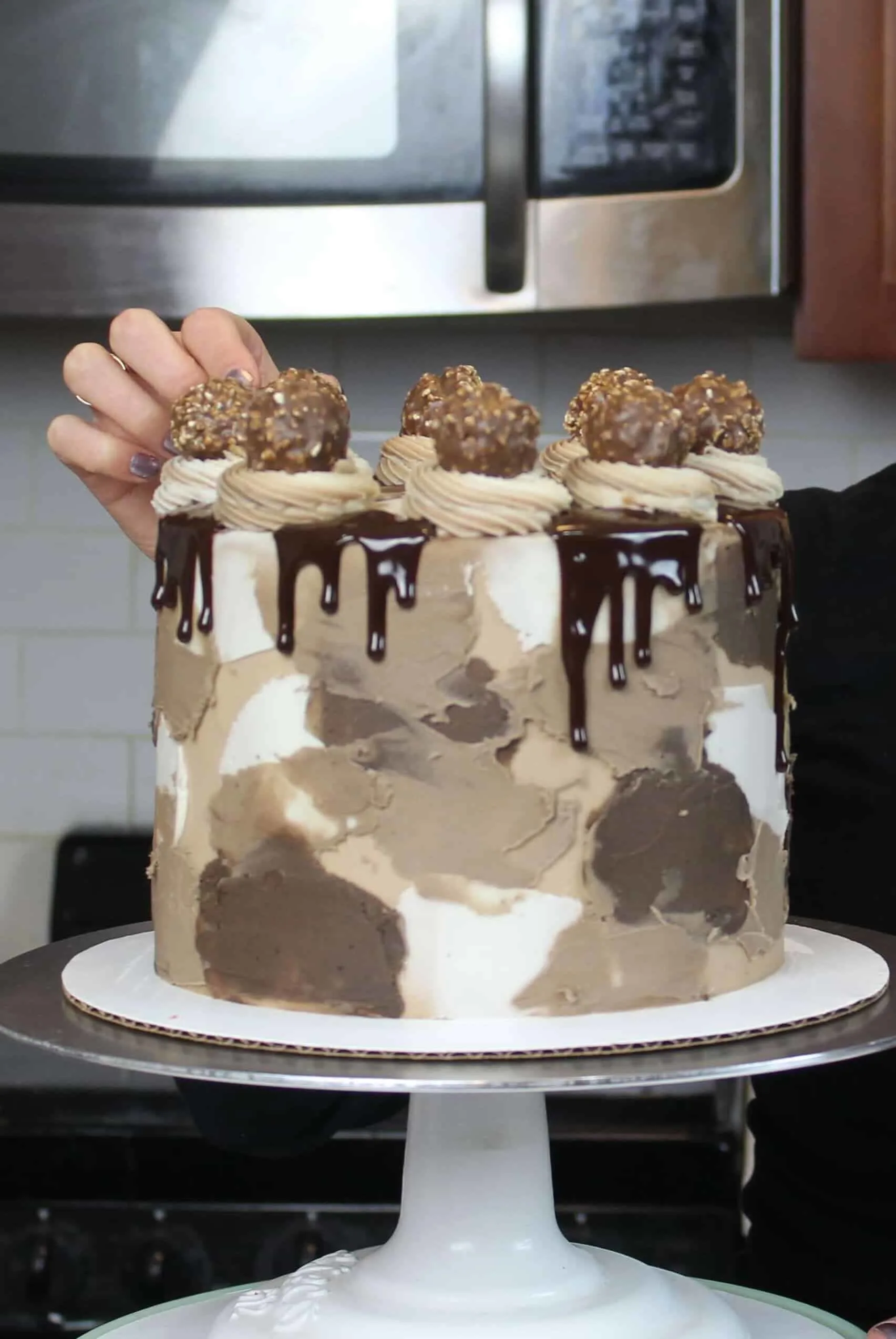 ultimate nutella cake with a partial chocolate drip