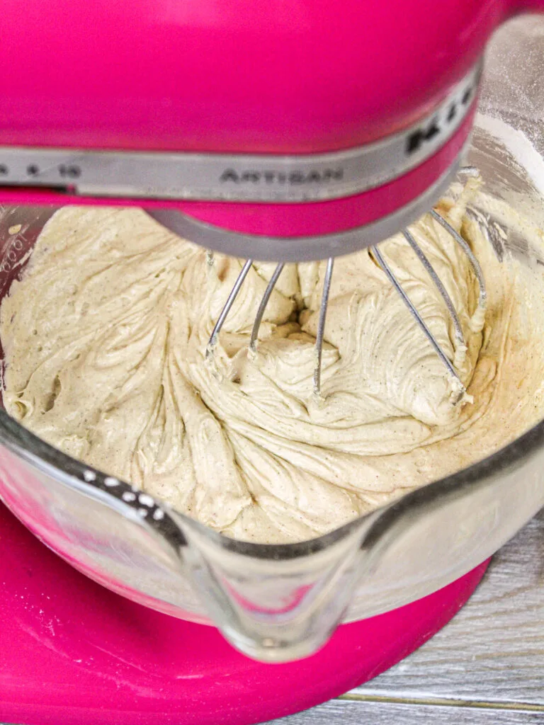 image of spice cake batter being mixed in a hot pink kitchen aid
