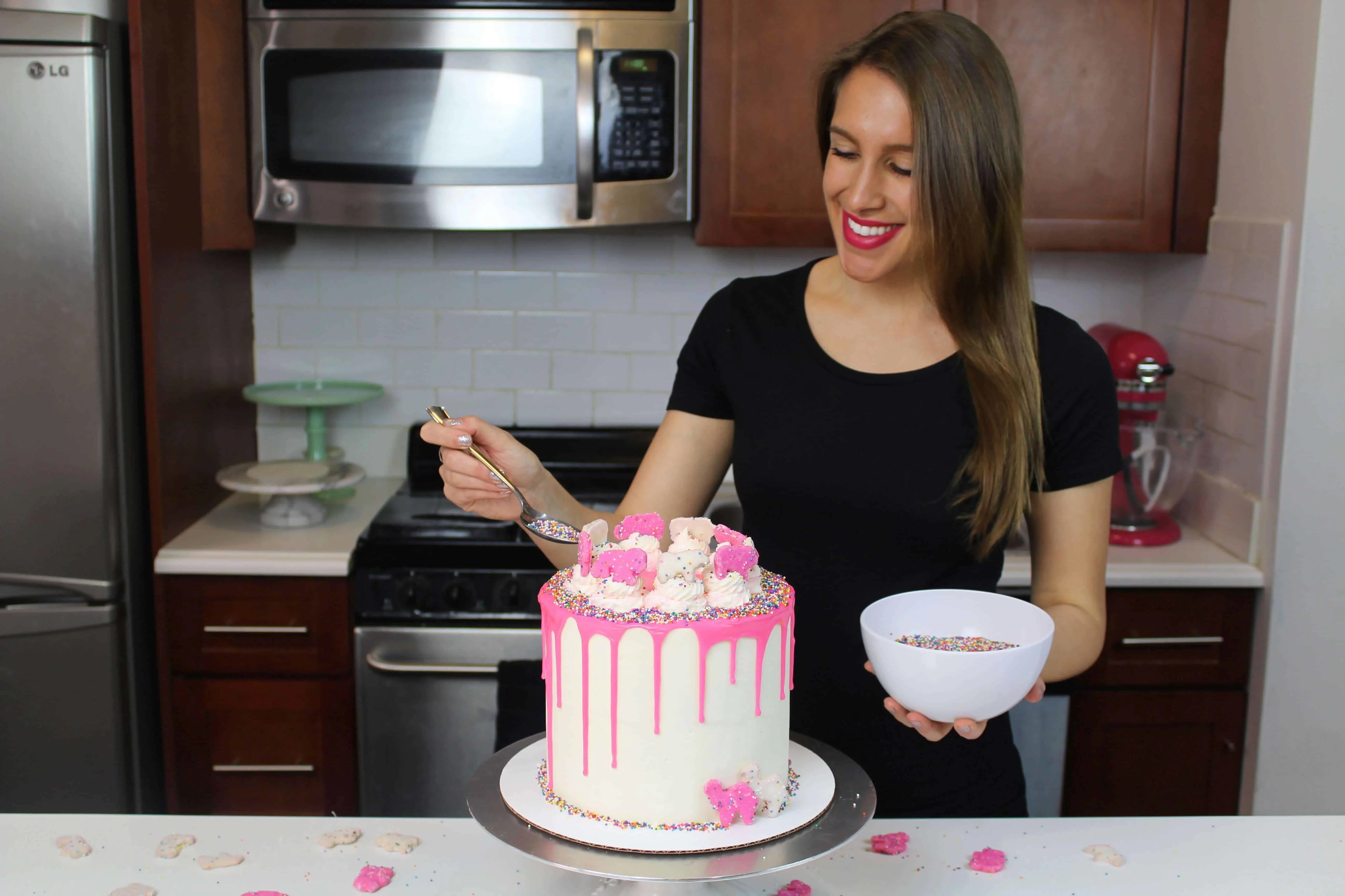 me adding sprinkles to circus animal cake