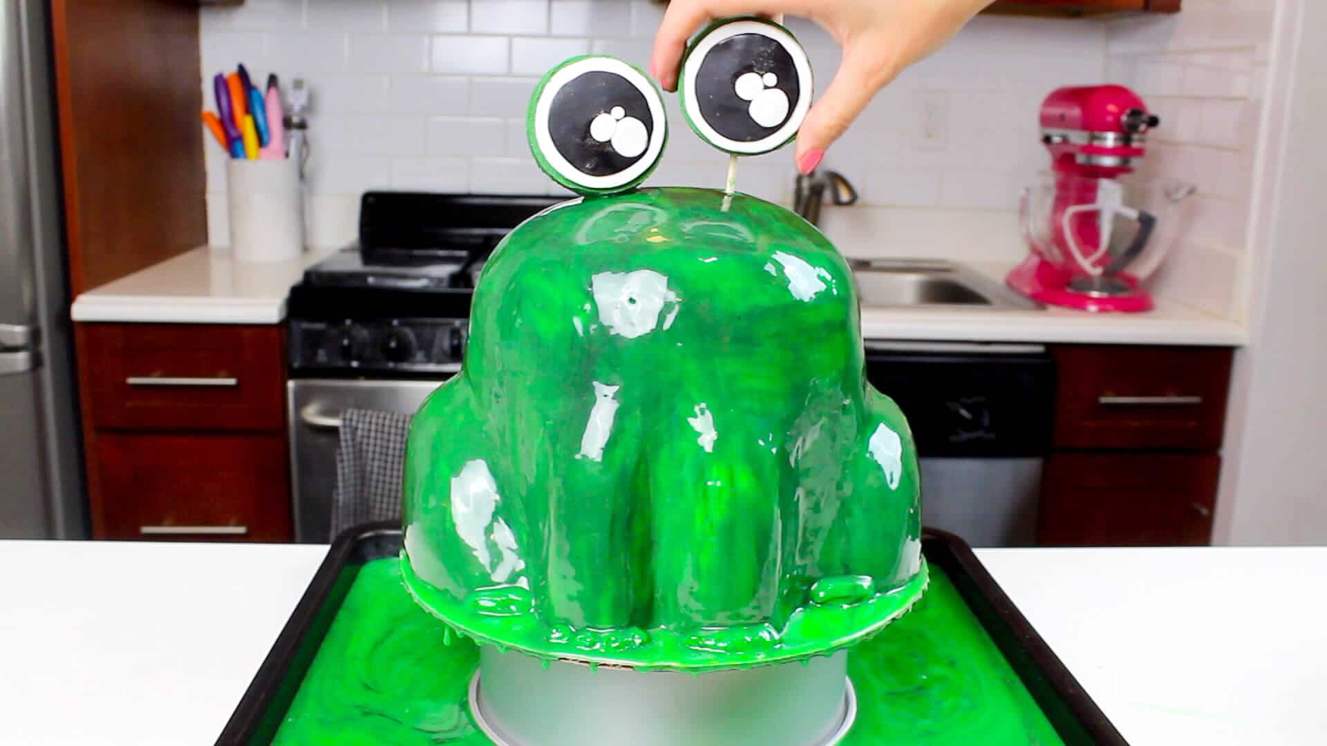 adding eyebll to frog cake