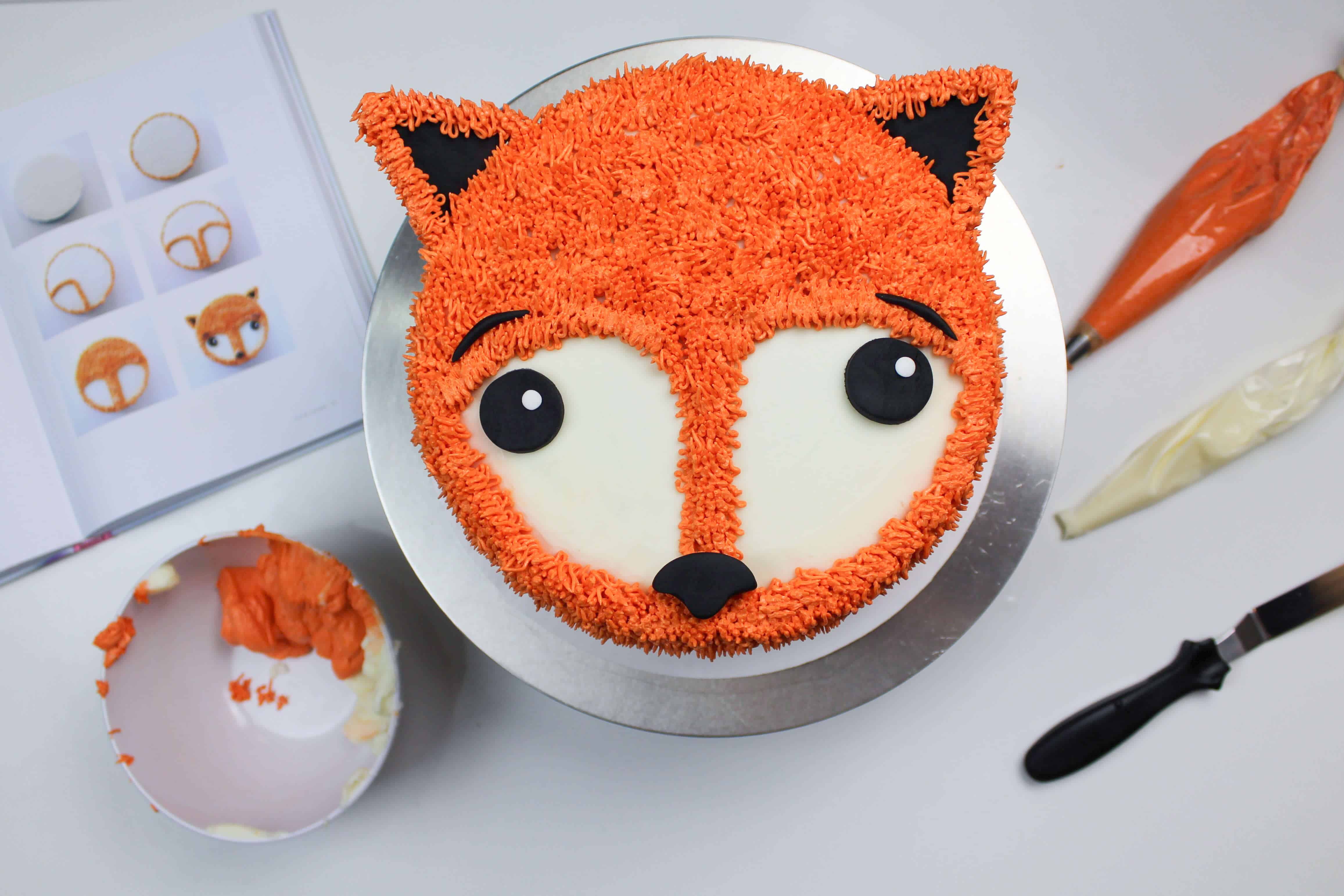 image of a cute fox cake decorated with buttercream