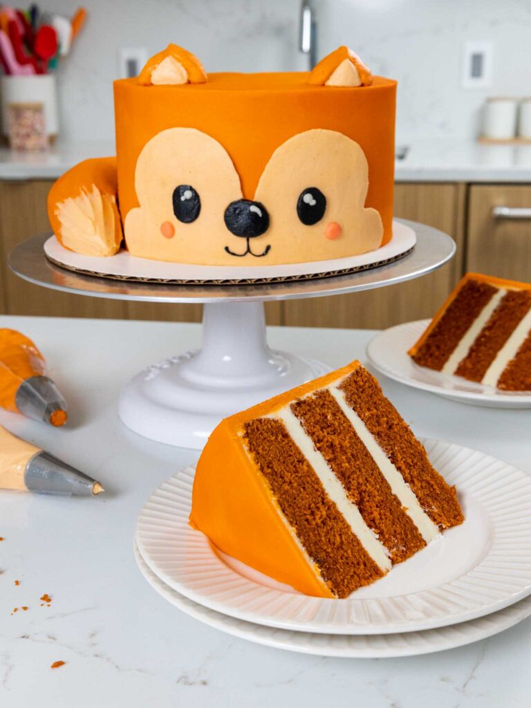 image of a cute fox cake made with buttercream and orange velvet cake layers