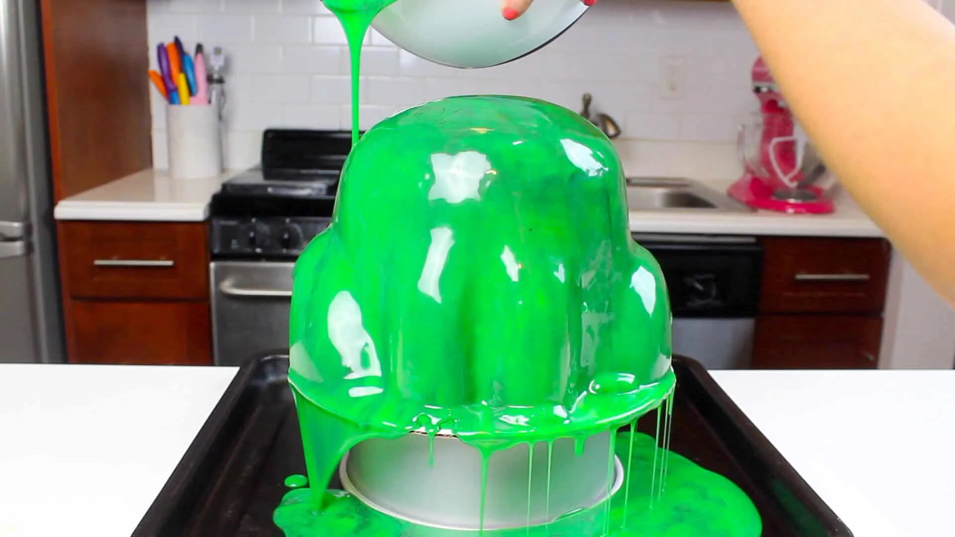 pouring glaze over frog cake #2