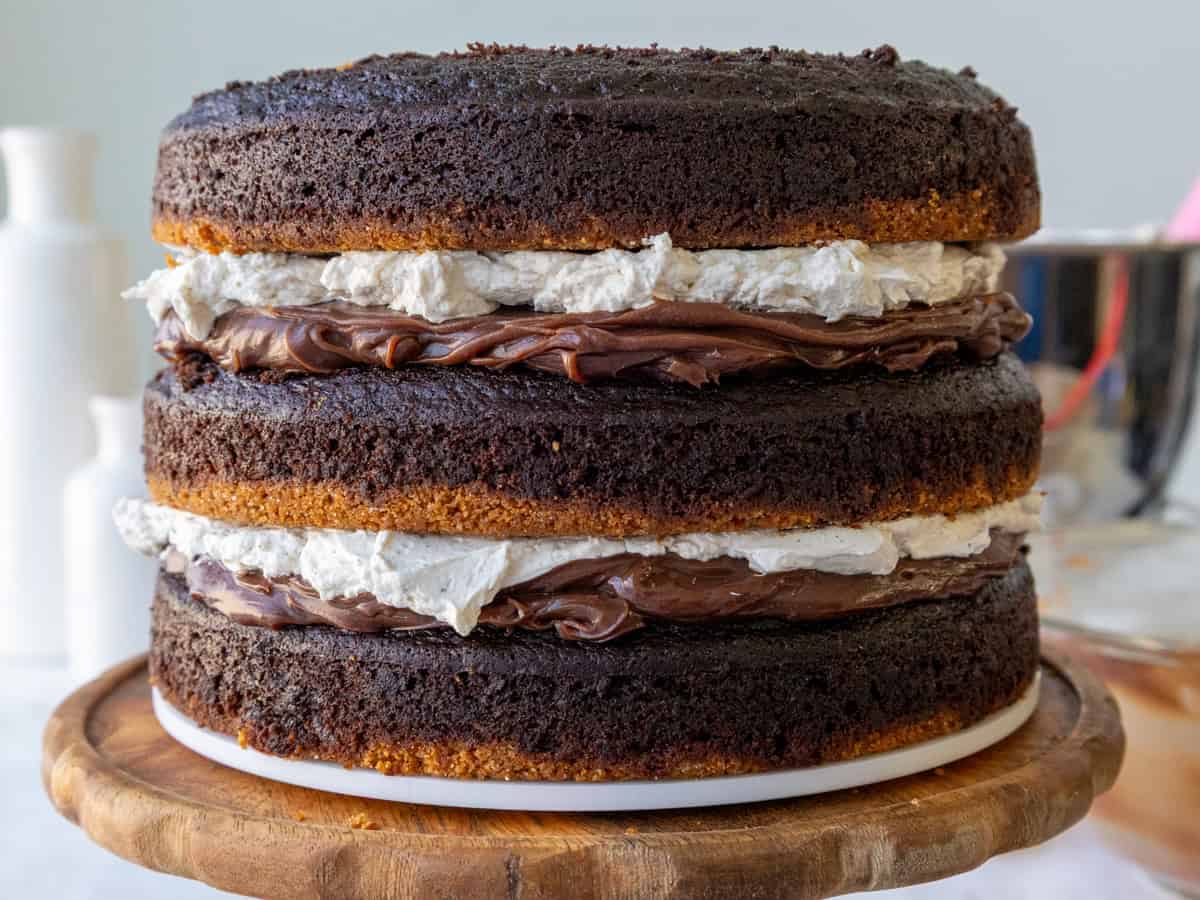 image of a smores cake that's been filled with milk chocolate ganache and toasted meringue buttercream