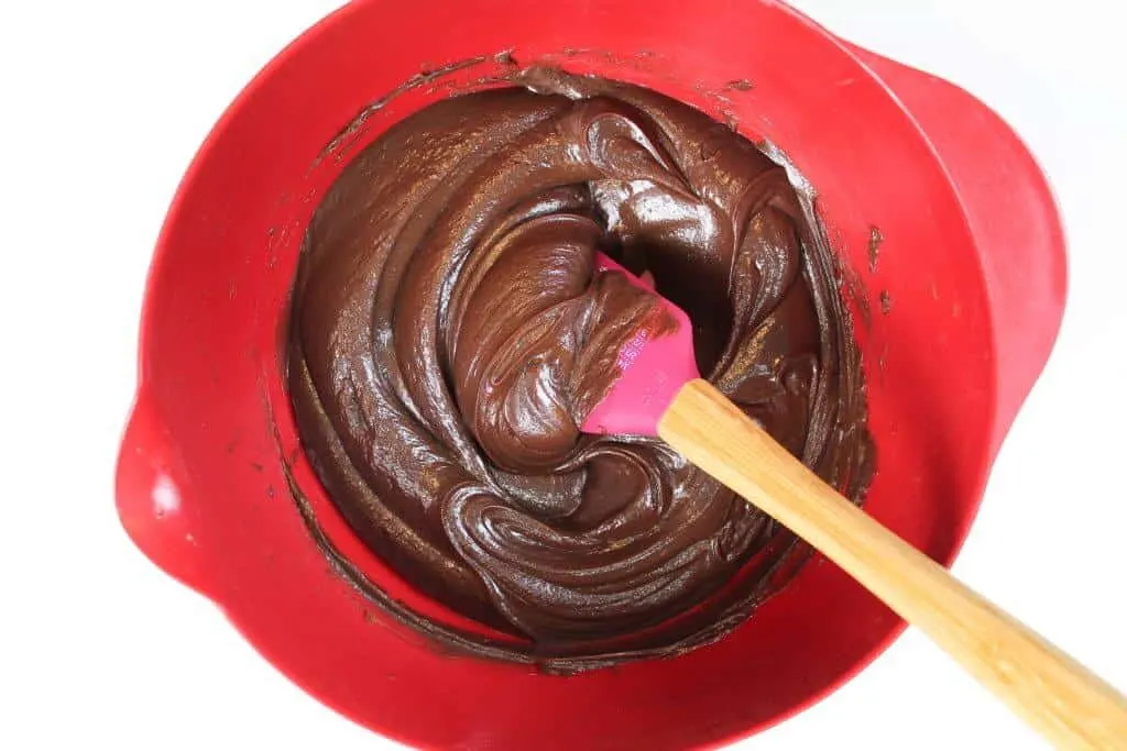 image of chocolate ganache frosting made by chelsweets with milk chocolate and heavy cream