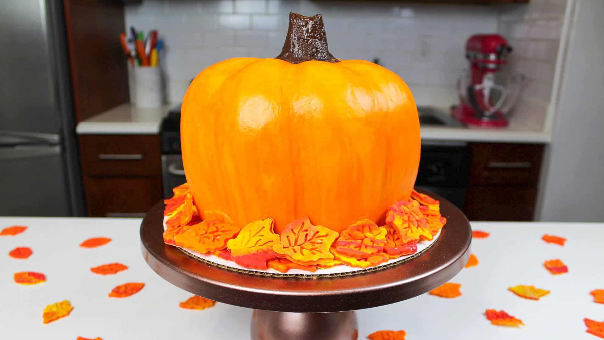 image of a pumpkin shaped cake made with buttercream
