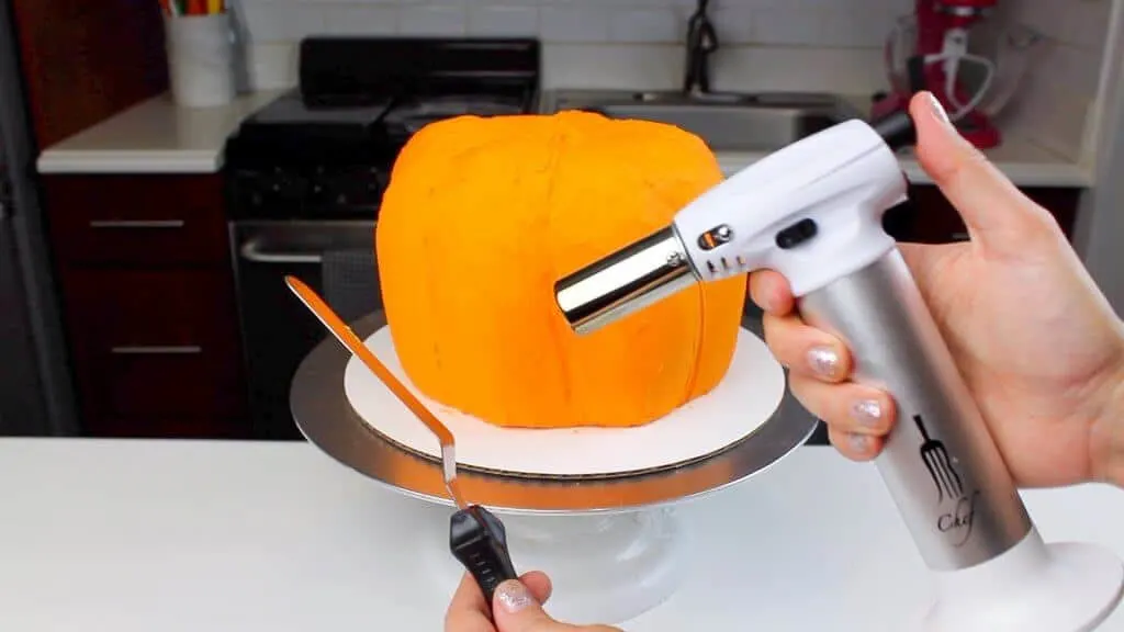 image of heating up an offset spatula with a kitchen torch