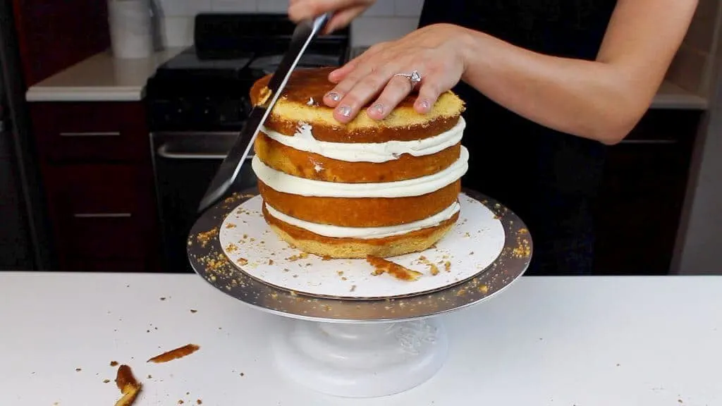 image of trimming pumpkin spice cake layers