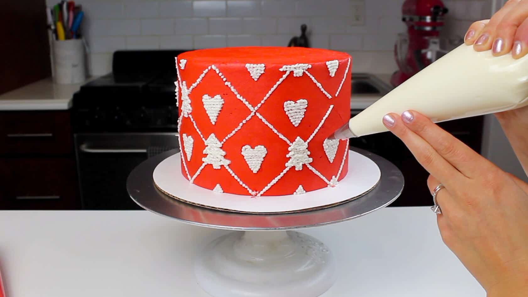 image of piping pattern onto knitted sweater cake