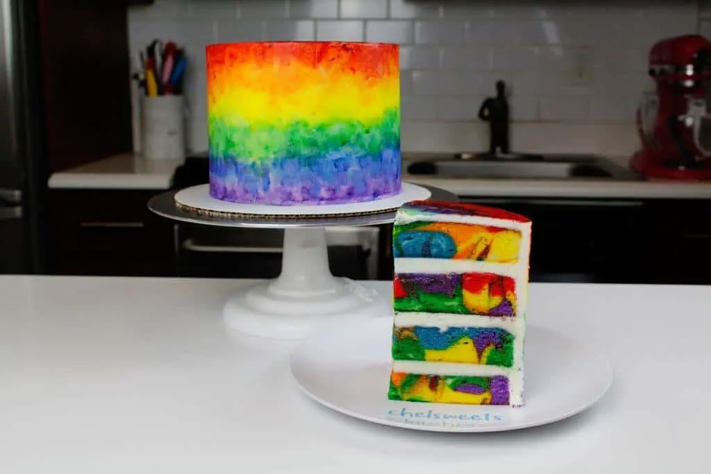 Swirled and marbled rainbow cake layers