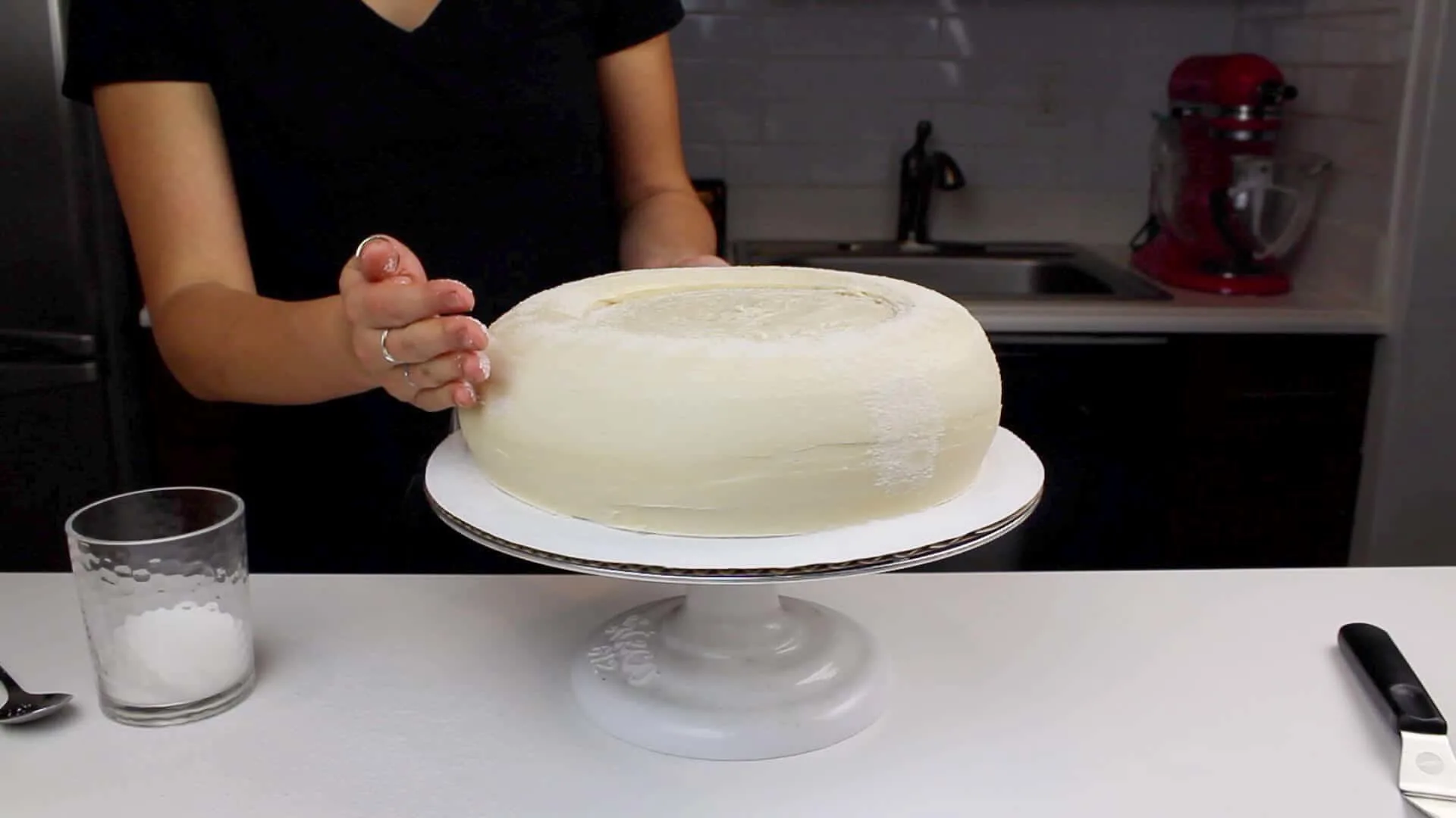 image of adding granulated sugar to a giant peanut butter blossom cake
