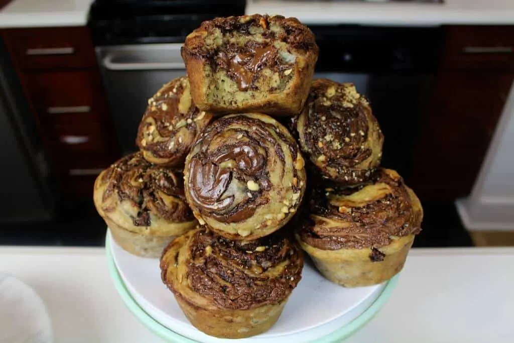 image of banana nutella muffins stacked on a plate
