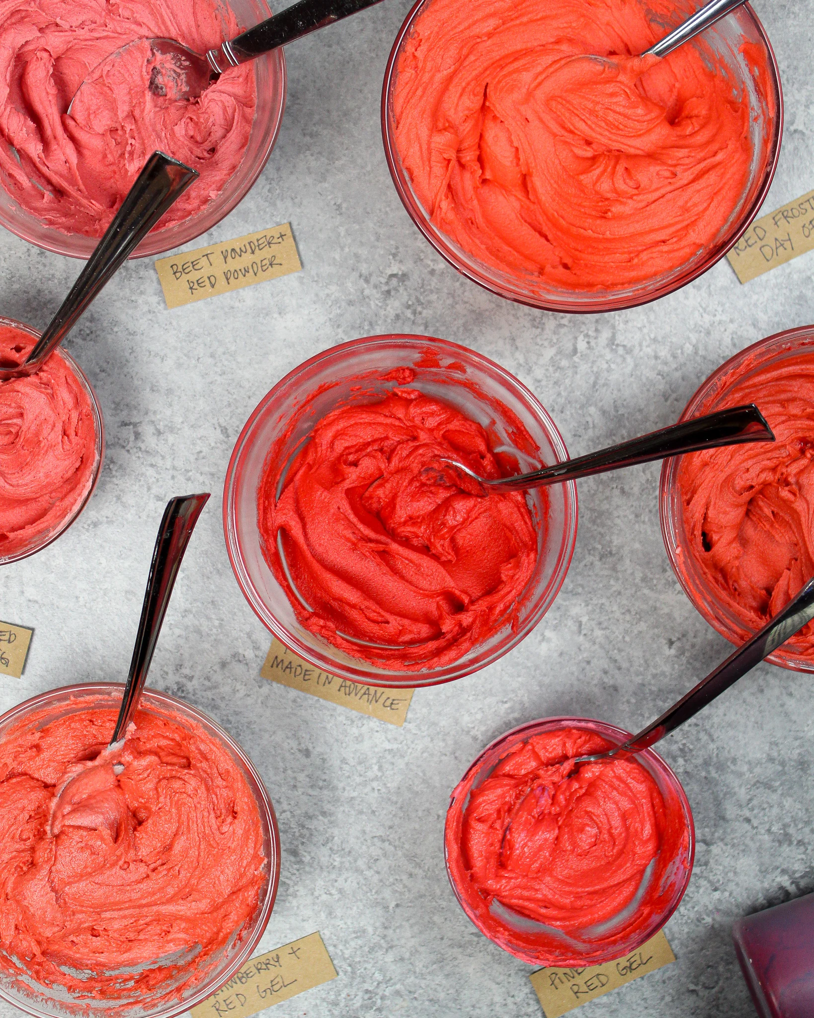 image of red buttercream frosting in a bowl