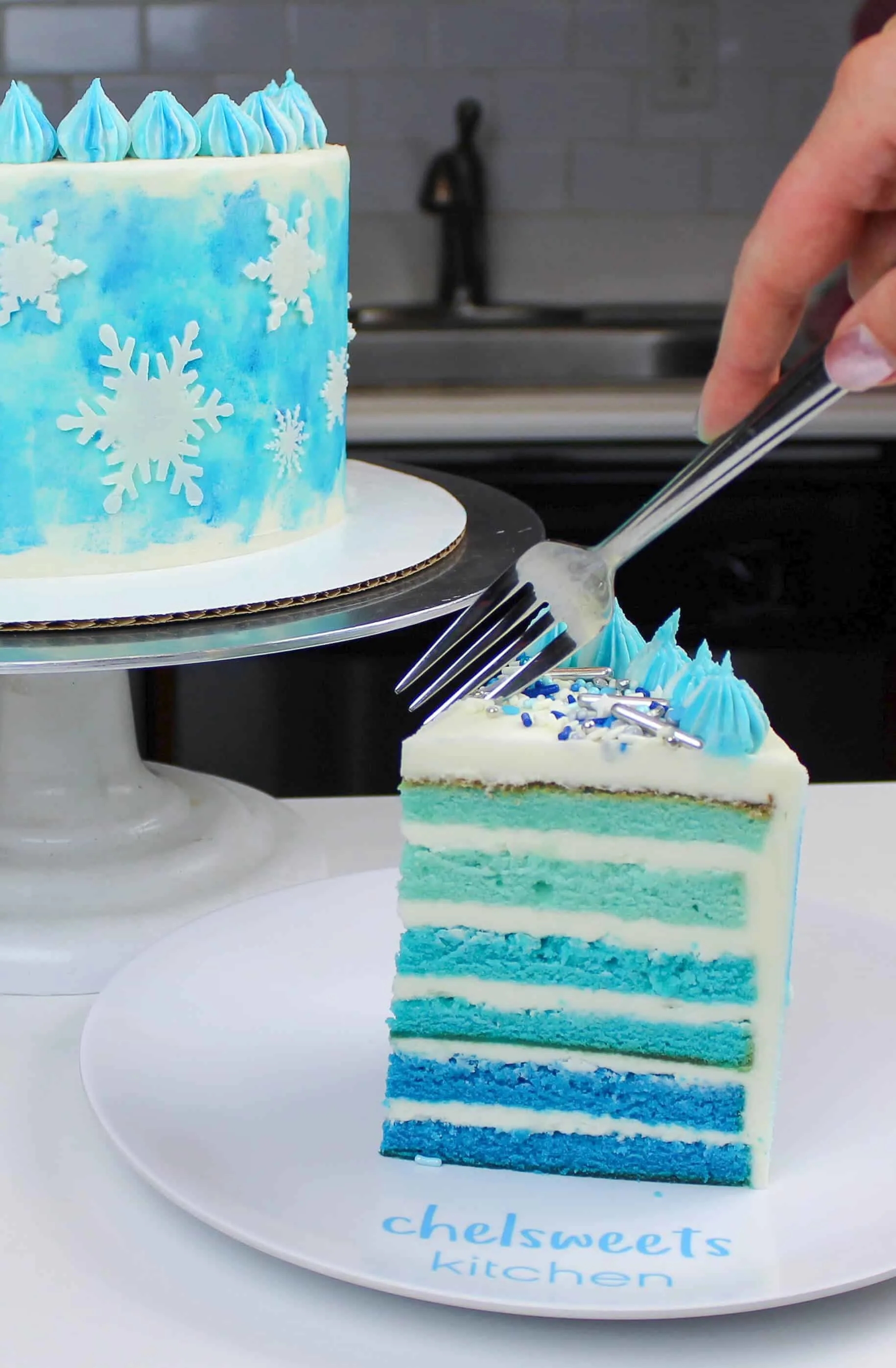 The perfect winter cake! An ombre blue cake decorated with buttercream snowflakes