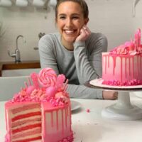 Photo of Chelsey White with pink candy drip cake