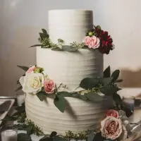 image of a wedding cake sized out using a cake portion guide to determine how many servings and what size of cake needed to be made