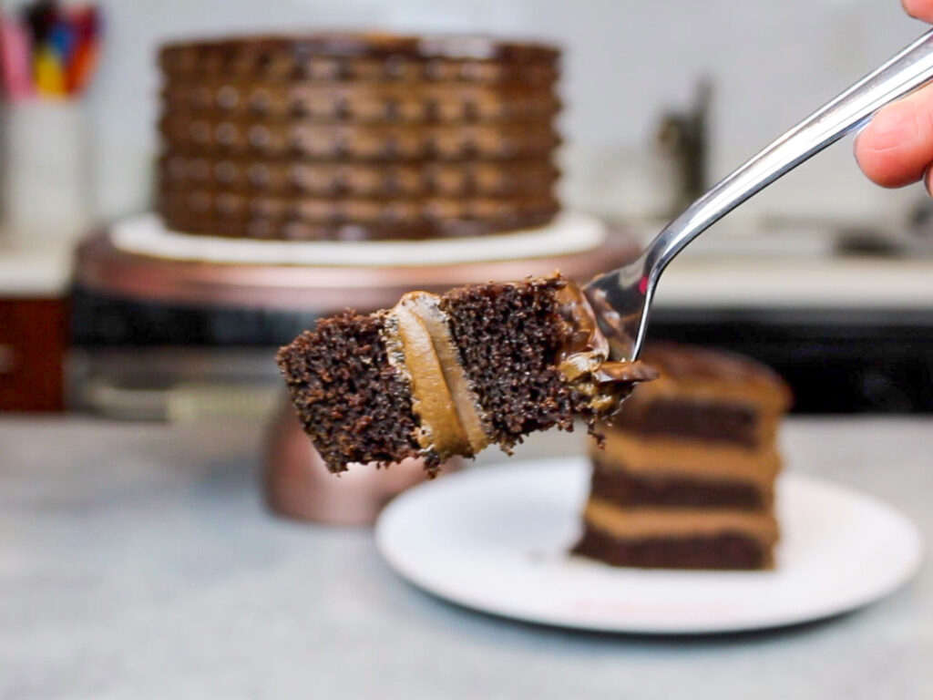 image of a bite of baileys chocolate cake on a fork