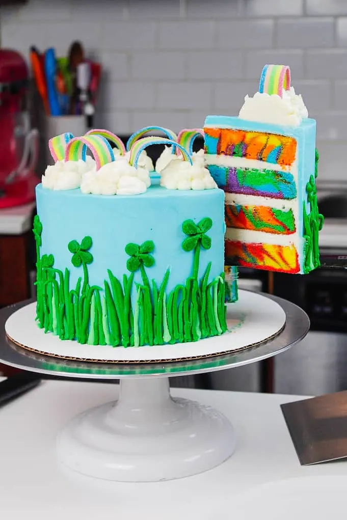 image of a rainbow st. patrick's day cake with four leaf clovers